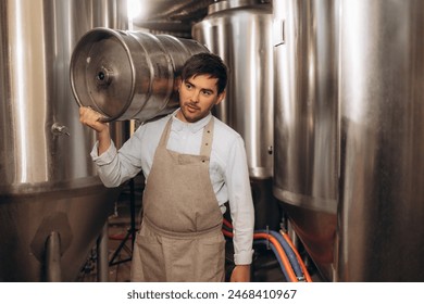 Brewer carrying keg at brewery factory - Powered by Shutterstock