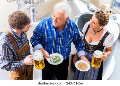 Brewer And Couple In Beer Brewery Guided Tour