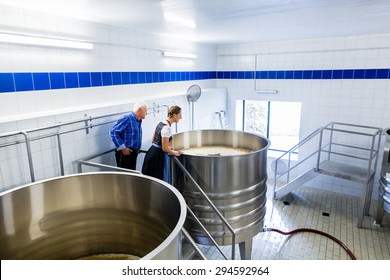 Brewer And Couple In Beer Brewery Guided Tour