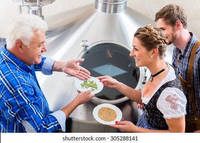 Brewer And Couple In Beer Brewery Guided Tour