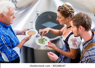 Brewer And Couple In Beer Brewery Guided Tour