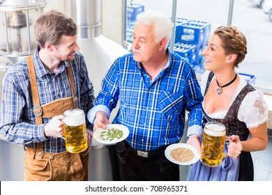 Brewer And Couple In Beer Brewery Guided Tour Close To Brewhouse