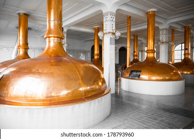 a brewery building interior, container cooking pots