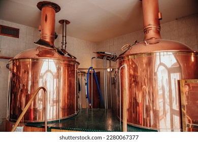 brewery, copper vats with beer. View of beer brewery interior with traditional fermenting copper vats. Modern brewery. Craft beer production line. Copper tanks for brewing - Powered by Shutterstock