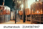 Brewery equipment. Brew manufacturing. Round cooper storage tanks for beer fermentation and maturation