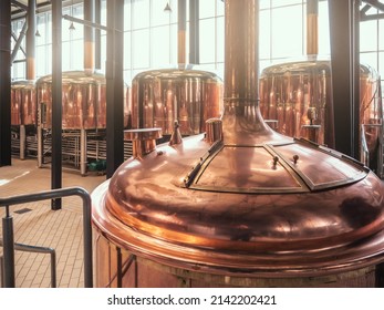 Brewery equipment. Brew manufacturing. Round cooper storage tanks for beer fermentation and maturation - Powered by Shutterstock