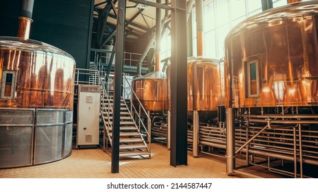 Brewery equipment. Brew manufacturing. Round cooper storage tanks for beer fermentation and maturation - Shutterstock ID 2144587447