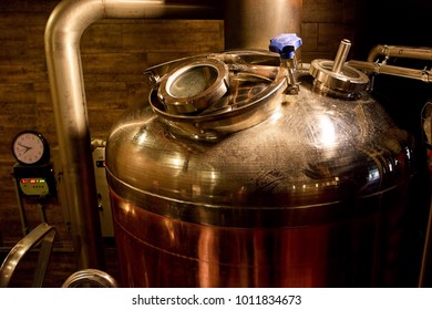 Brewery kettle closeup. Indoor brewery in basement, closeup.