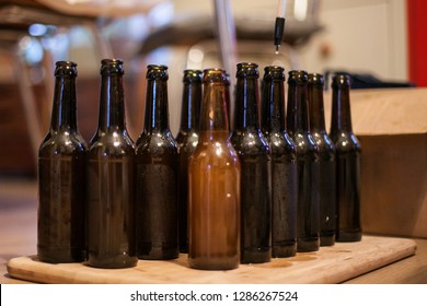 Brewing Beer At Home - Make Your Own Ale. Filling The Bottles