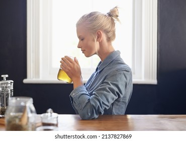 Brewing Some Herbal Tea. A Young Woman Making Herbal Tea.