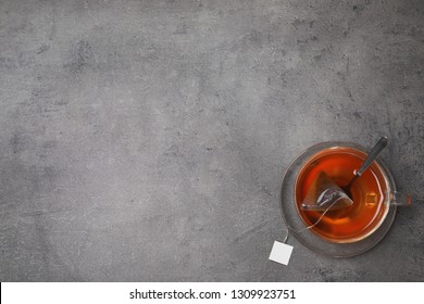 Brewing Tea With Bag In Cup On Table, Top View. Space For Text