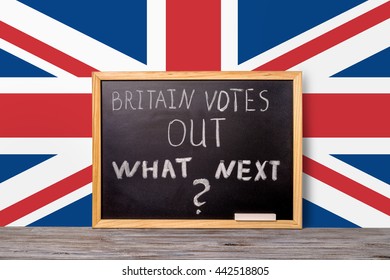 Brexit UK EU Referendum Final Results Concept For Out Of Great Britain From Rest European Union And Handwriting Text Britain Votes Out What Next Written In Chalkboard On Flag Background