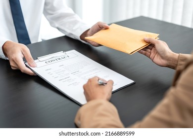 Bribe employer offer terms to a businessman for signing on contract while making corruption about real estate. - Shutterstock ID 2166889599