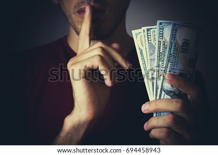 Bribery people with dollar bills in hand and quiet gesture [[stock_photo]] © 