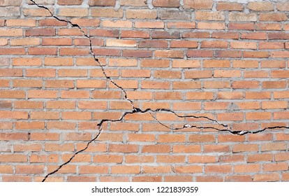 Brick building with cracked foundation                               