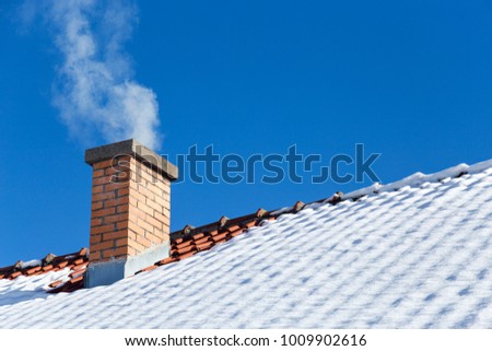Brick chimney on the roof