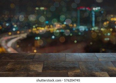 Brick copyspace with view looking onto the city skyline and highway showing night life area with a good energetic city vibe and cityscape.