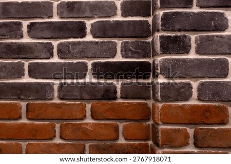 Brick corner is showing in flat design closeup with charcoal, reddish bricks, mortar seam, chips. Masonry, wall, twotone, texture, pattern, aging, weathered