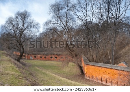 A brick defensive wall surrounding the former Russian tsarist fortress