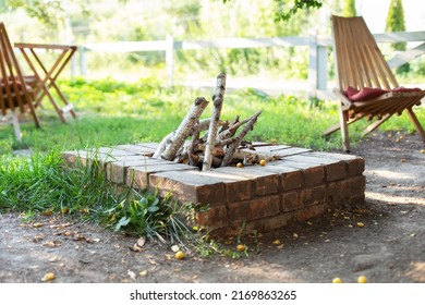 Brick Fireplace In Garden. Design Street Fireplace And Built By Brick At Backyard At Home. Party Outdoor Concept. Concrete Stone Fireplace To Ignite The Wood. The View Of A Backyard Fire Pit With Logs