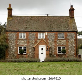 Brick and Flint Cottage on an English Village Green