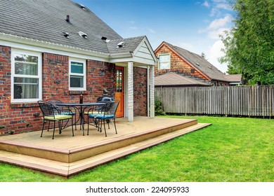 Brick House With Walkout Wooden Patio Area