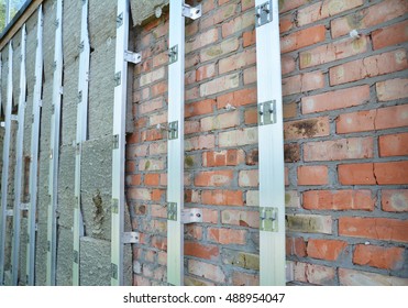 Brick House Wall Repair And Rock Wool Or  Mineral Wool  Wall Insulation. External Wall Insulation - Save Energy.