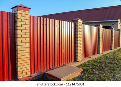 Brick and Metal red Fence with Door and Gate of Modern Style Design Metal Fence Ideas.
