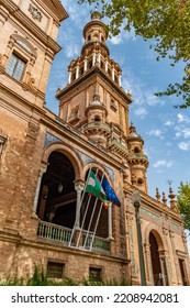 Brick Palace With Tower And Moorish Style Arches And Flags In Plaza De España, Seville SPAIN