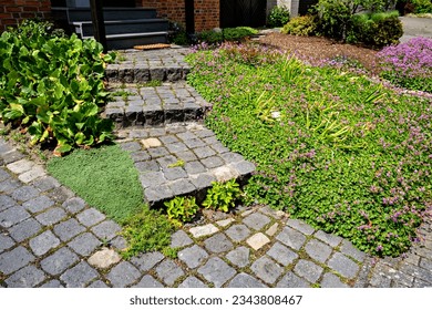 Brick pathway leads up to brick building with steps leading up to it in Germany. - Powered by Shutterstock