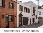 Brick rowhouses with shutters in historic Mount Vernon in Baltimore Maryland