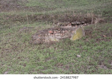 A brick structure in a field