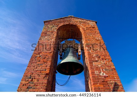 brick tower with bells ringing to tell the time
