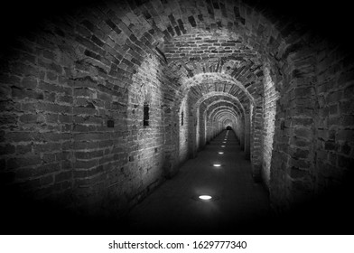 Brick tunnel archway made of red bricks as a passage between the two wings of a medieval castle. Granite stone an brick built Interior corridor way to bastions - Shutterstock ID 1629777340