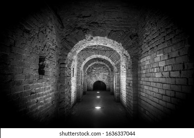 Brick tunnel archway made of red bricks as a passage between the two wings of a medieval castle. Granite stone an brick built Interior corridor way to bastions - Shutterstock ID 1636337044