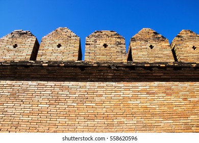 brick wall background and blue sky