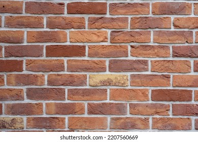brick wall background, brick wall in red. Orange brick fence can be used as background. Modern red brick wall texture for background. Old dud wall with shadow texture can be use as background. - Shutterstock ID 2207560669