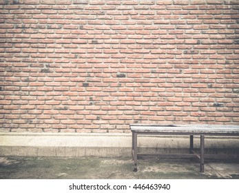Brick wall background textured and pattern with old chair,vintage style.