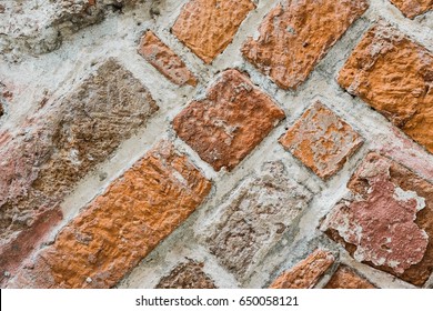 Brick wall  background. Use as design element of residential and office interiors, rough, cracked roughness, the weathered masonry. Architecture abstract pattern.