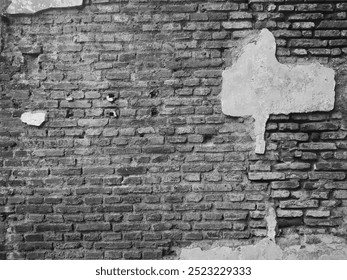 Brick wall for background.Background of old building wall, with peeling cement plaster. red brick wall on old building. black and white photo.High quality image