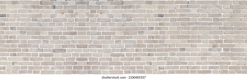 Brick wall of beige stone panorama background