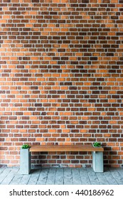 a brick wall with bench