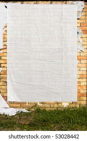 Brick Wall With Blank Poster And Torn Posters - Empty Banner
