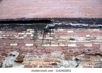 Brick Wall With Broken Lead Flashing.