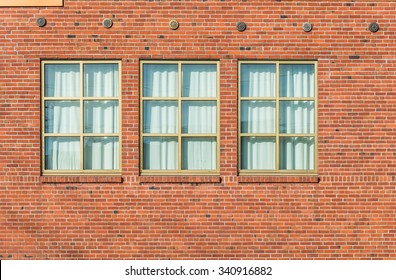 brick wall with curtain windows  ,surface  of cargo,warehouse in old industrial  zone.