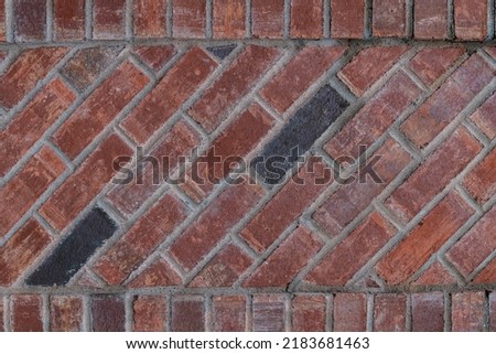 A brick wall with a diagonal bond texture background