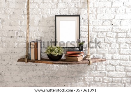 brick wall  drift wood shelves and frame concept decor

