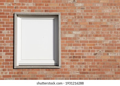 Brick Wall With Frame, Facade With Red And Even Surface, White Window With Space For Text 