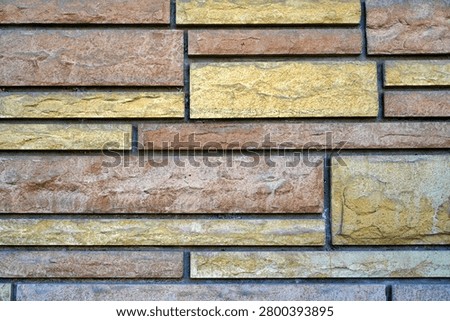 Brick wall with maze-like line pattern – abstract architectural design                              