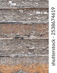 Brick wall of an old house partially destroyed as a result of World War II